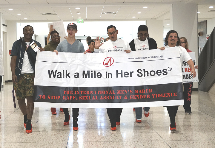 Students and faculty march across campus for LU’s annual “Walk a Mile in Her Shoes,” Tuesday. The march is part of the international men’s march that brings awareness to sexual assault, rape and gender violence. UP photo by Abigail Pennington