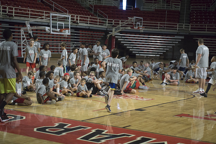 Tommy Strine teaches kids the fundamentals of basketball, Thursday in the Montagne Center. UP photo by Cade Smith