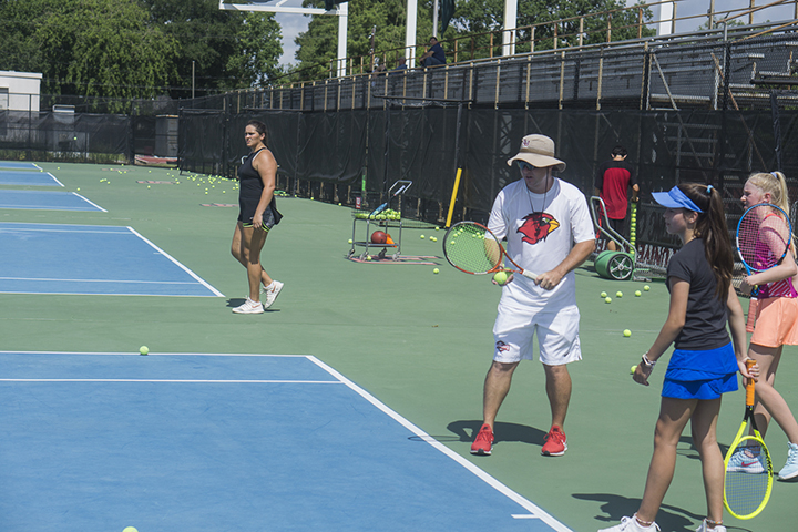 Scott Shankles, LU men's head coach, teaches the fundamentals of tennis to campers at the Thompson Family Tennis Center, Wednesday. UP photo by Cade Smith 