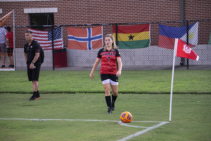LU forward Lucy Ashworth prepares to kick a corner kick against Oklahoma St. defenders at the LU Soccer Complex, Thursday. UP photo by Cade Smith