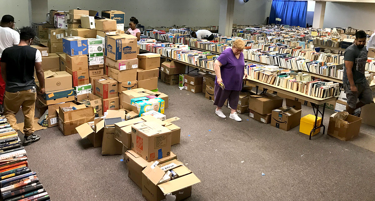 Volunteers sort books in advance of the 10-cent book sale at the Beaumont Public Library, Sept. 3. UP photo by Claire Robertson