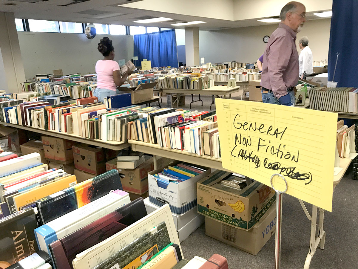 Volunteers sort books of the 10-cent book sale at the Beaumont Public Library, Sept. 3. The sale will be held Sept. 6-7. UP photo by Claire Robertson