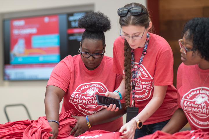members of the Cardinal Activities Board sort out T- shirts to give away during the 2019 Homecoming kickoff in the Setzer Student Center, Monday. UP photo by Noah Dawlearn