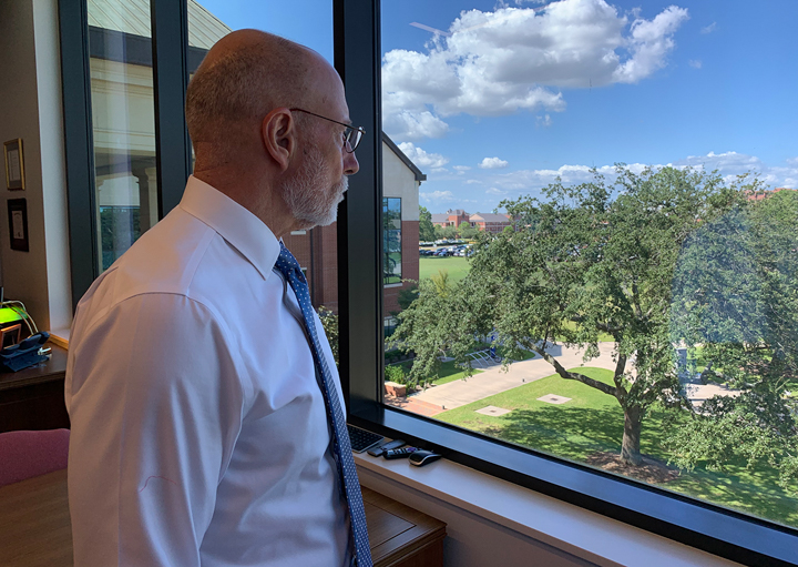 LU President Kenneth Evans looks out at the campus from his office in the Reaud Building, Tuesday. 