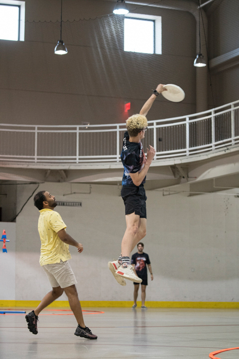 A student catches a frisbee in the Sheila Umphrey Recreational Sports Center Indoor Soccer Arena, Aug 27. UP photo by Noah Dawlearn 