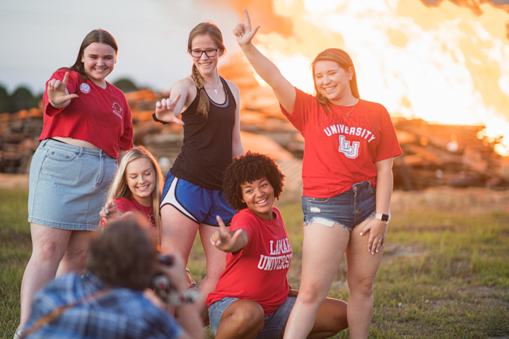 Students make the LU sign during Lamar University's Homecoming Pep Rally and Bonfire, Sept. 27. UP photo by Noah Dawlearn
