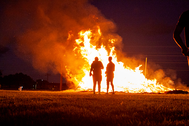 Students watch the bonfire burn at Lamar University's Homecoming Pep Rally and Bonfire, Sept. 27.