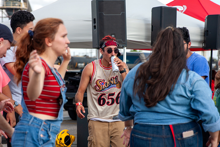 Students bust a move as they prepare for the homecoming game during tailgating at the Provost Umphrey Stadium. UP Photo by Delicia Rocha