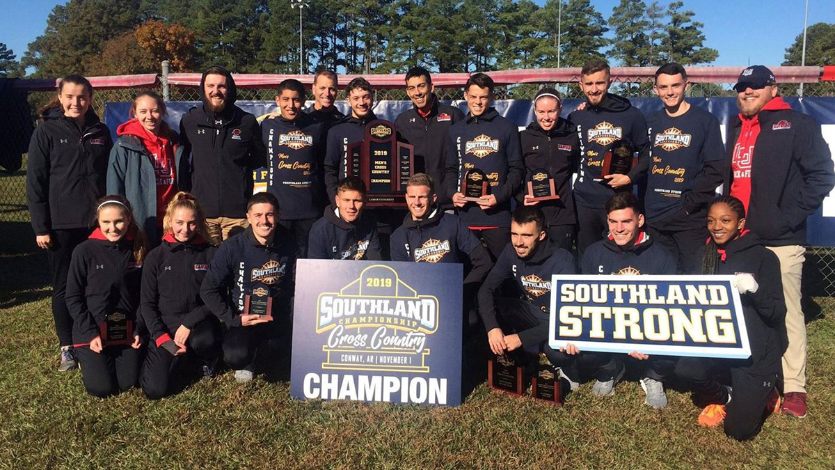 The Lamar University cross country teams pose with the men’s Southland Conference title trophy, Nov. 1. Courtesy photo