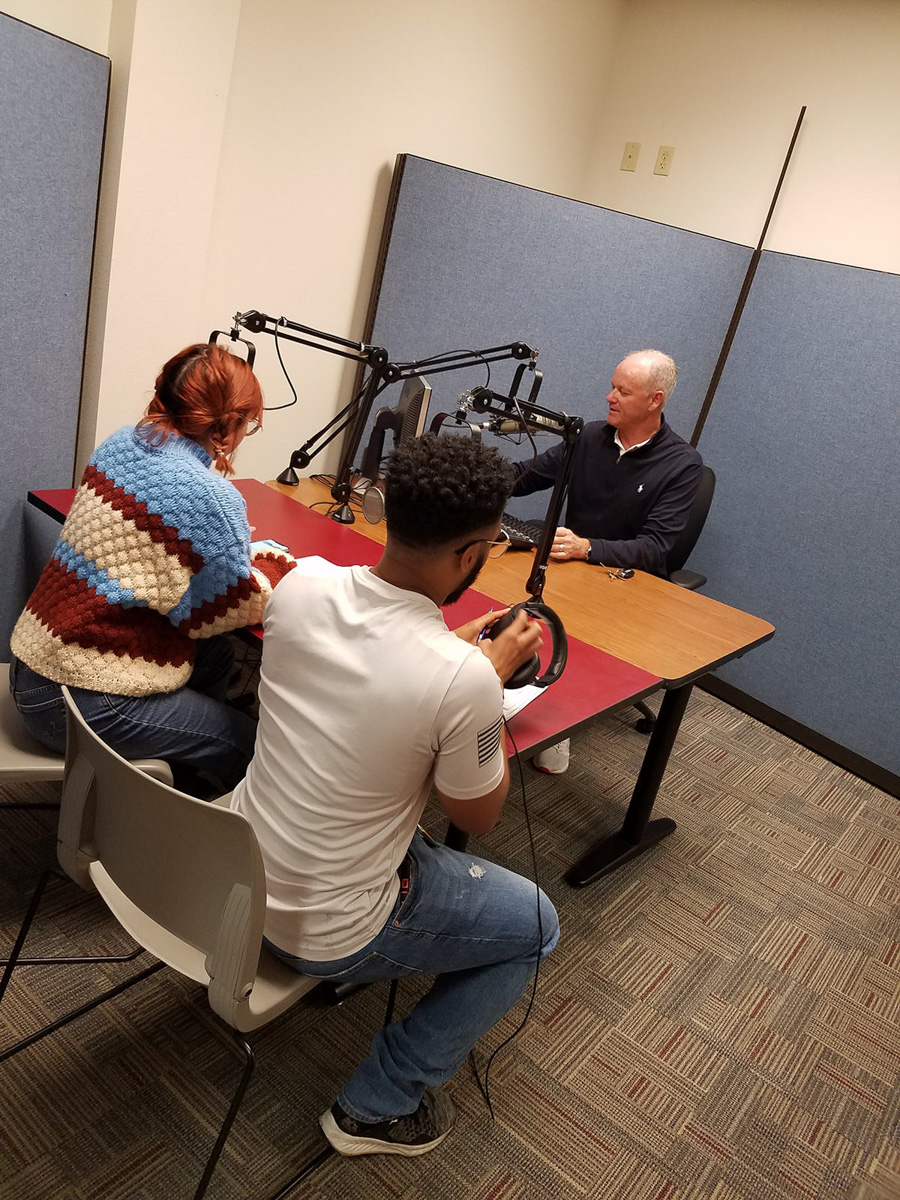 Vanessa Guerrero, Nederland junior, and Derrick Thomas, Lake Charles senior, sit with Greg Kerr, KFDM anchor and LU communications instructor, in the communications department podcasting studio. UP photo by Sierra Kondos.