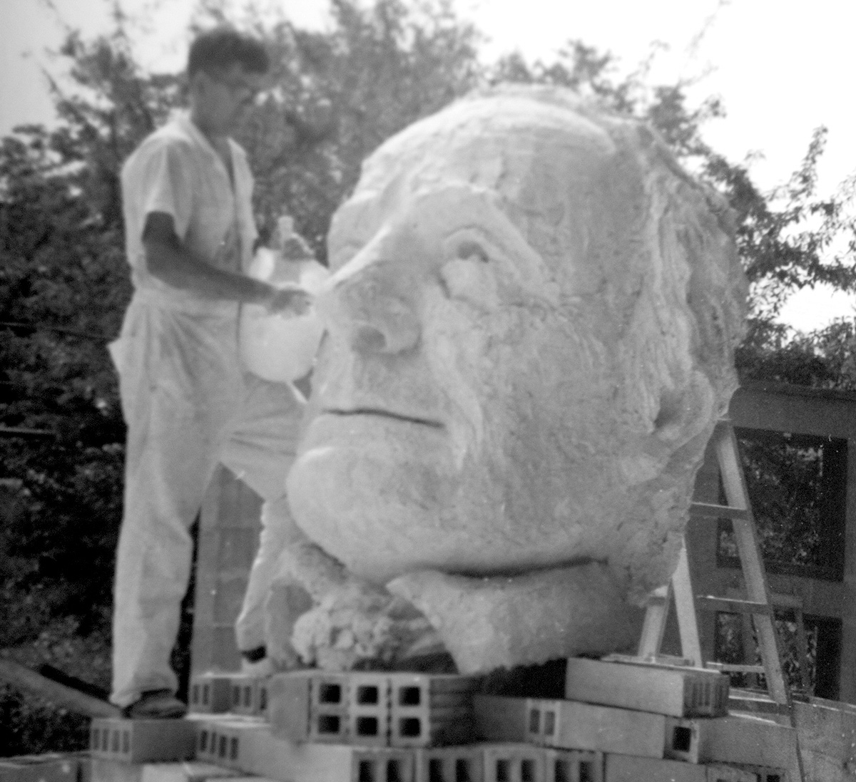 David Cargill works on the statue of Mirabeau B. Lamar, far left, which sits in the Quad at Lamar University.