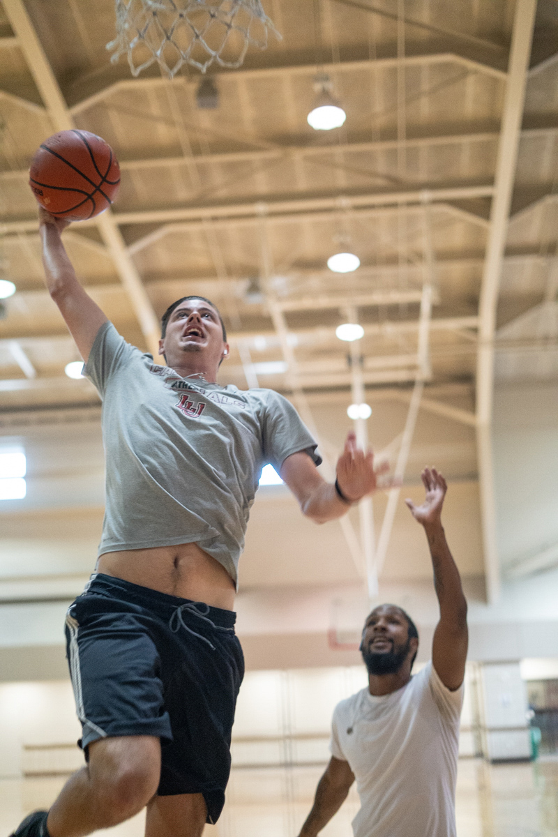 Philip Jacobs, left, goes for a layup against Zion Diggles, right, in the Sheila Umphrey Recreational Sports Center, Sept. 24. UP photo by Noah Dawlearn