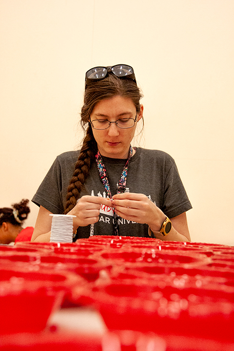 Senior Margaret Martin makes matching keychains for her and her roommate at Late Night at the Rec on Jan. 24 in the Sheila Umphrey Recreational Center. UP Photo by Delicia Rocha.