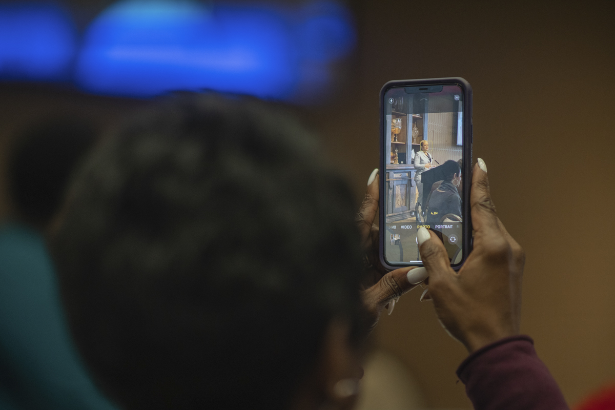 Zena Stephans, left, takes a picture of Japera N. Levine, right, the keynote speaker of the MLK day Event that was hosted in the 8th floor of the John and Mary Gray Library on Thursday. UP Photo by Noah Dawlearn