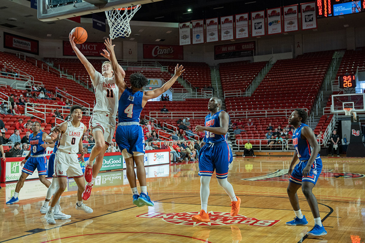 Anderson Kopp, freshman guard, goes up for a layup in the Montage Center in Saturday’s game against Houston Baptist. UP Photo by Noah Dawlearn.