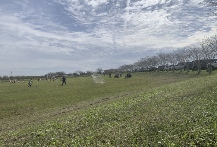 Children play at the Major Drive soccer fields, which double as retention ponds, March 7. UP photo by Christina Segura