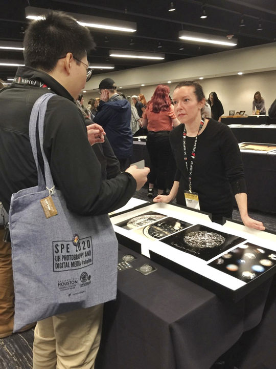LU photography student Brandi Hamilton discusses her portfolio during the Society for Photographic Education conference in Houston, March 8. Photo courtesy of Britt Thomas