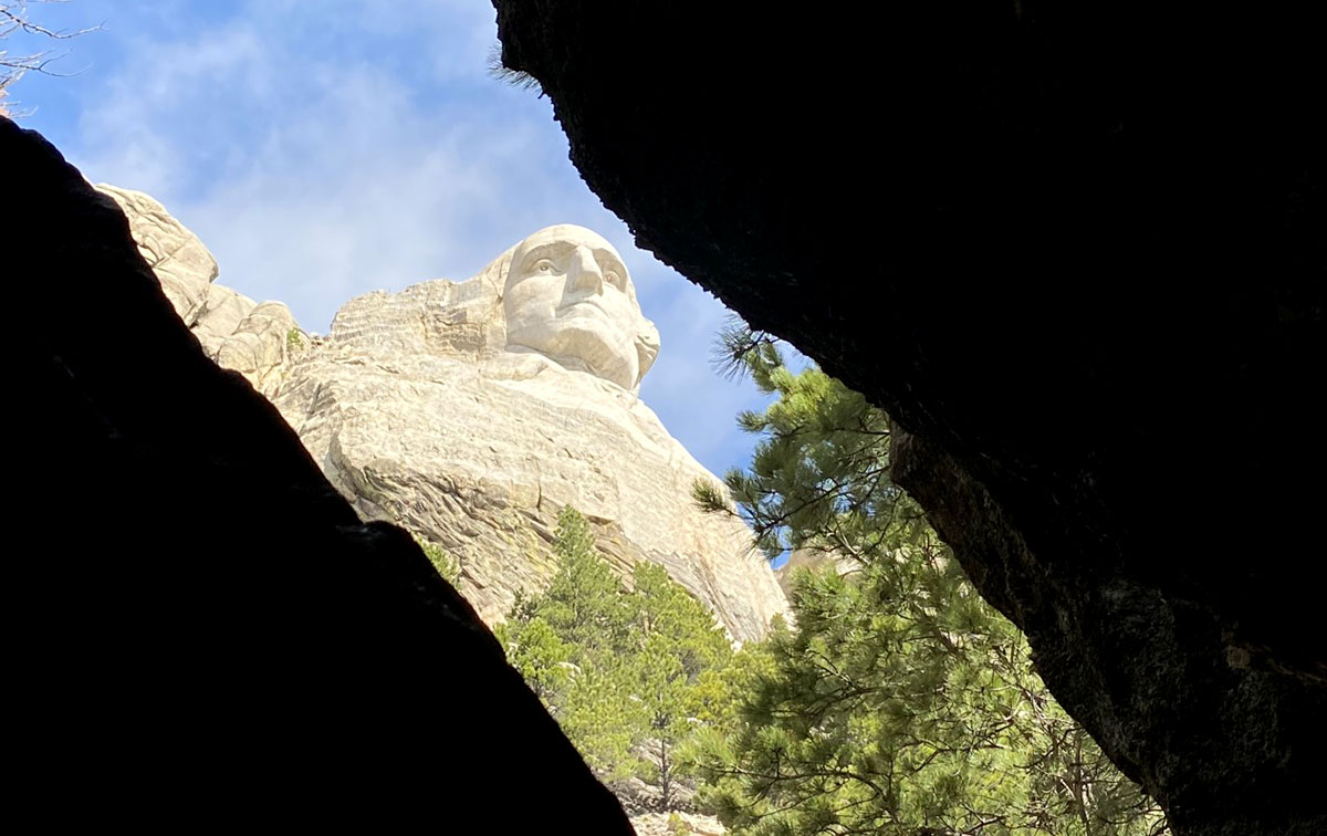 A close-up of George Washington from a small cave.