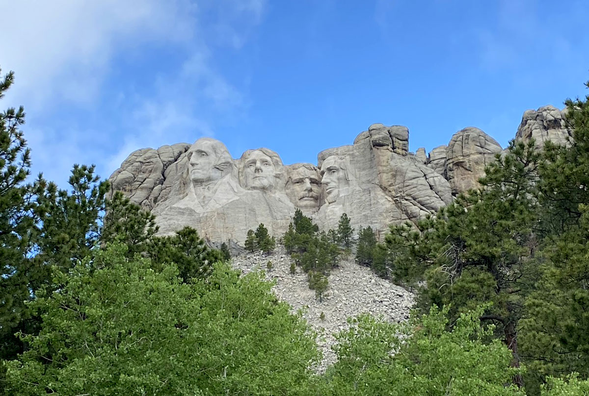 Mount Rushmore viewing point surrounded by trees.