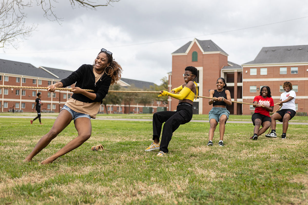 Female students play tug-of-war against each other at the Black History Month Block Party, Feb. 24, at Cardinal Park. UP photo by Brian Quijada.