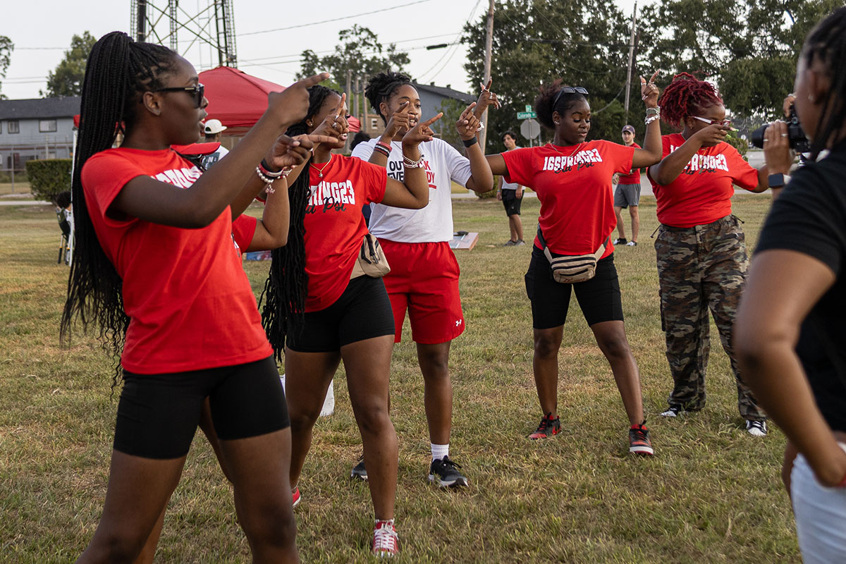 Members of Delta Sigma Theta sorority dance outside the field across the Provost Umphrey stadium before the game, Aug.31. UP photo by Brian Quijada.