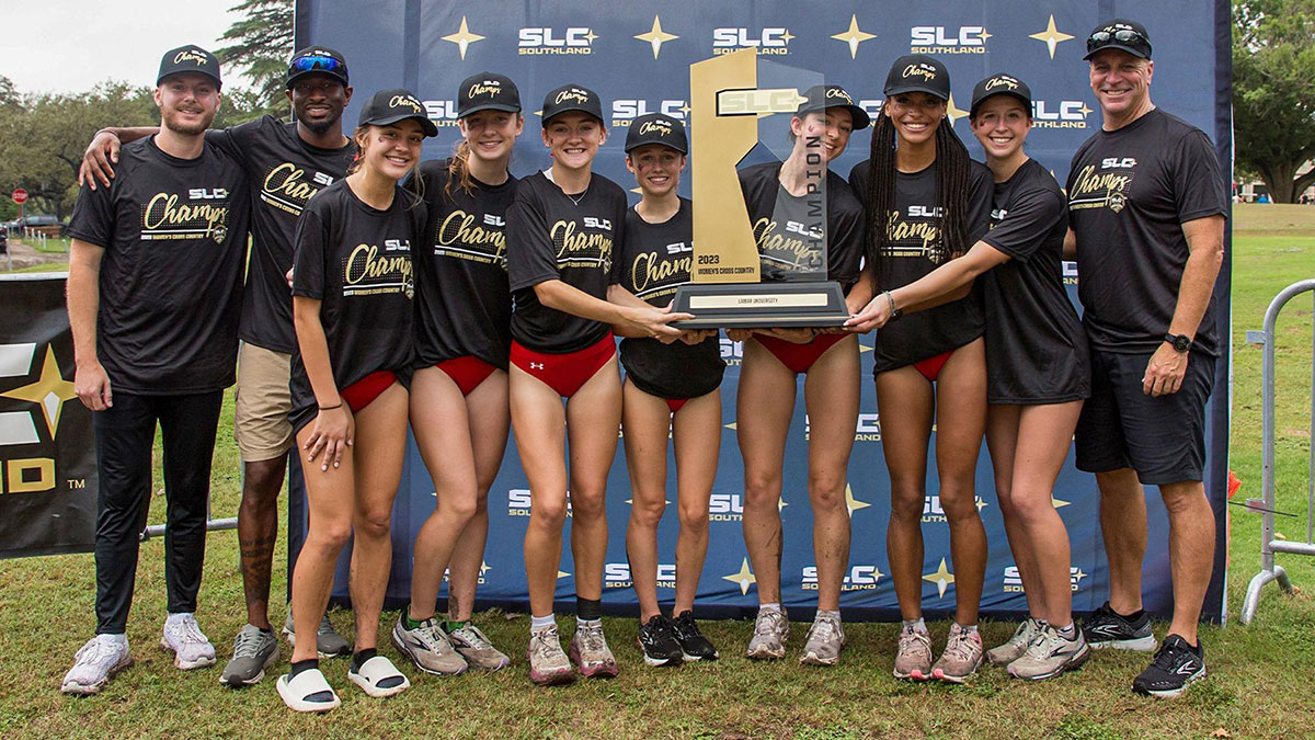 The Lamar University women’s cross country team pose with the Southland Conference tournament trophy. The team won its first title since 2014. Courtesy photo.