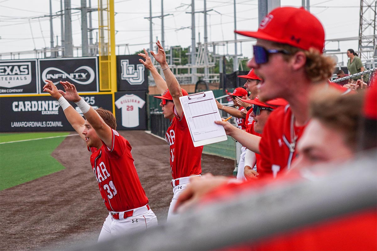 The Cardinals celebrate Tanner Wilson’s game winning hit against McNeese State University, at Vincent-Beck stadium, April 7, 2024. UP photo by Carlos Viloria.