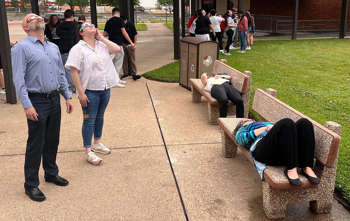Students and staff look up at the solar eclipse at Lamar University, April 8. UP photo by Taylor Justice.