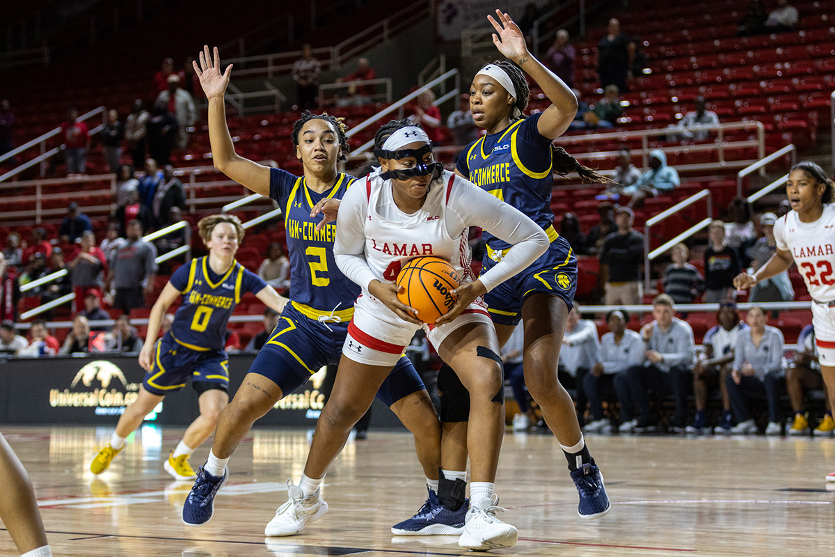 Lamar forward Akasha Davis goes in for a basket while being guarded by two TAMU-C defenders, Jan. 18, in the Montagne Center. UP photo by Brian Quijada.