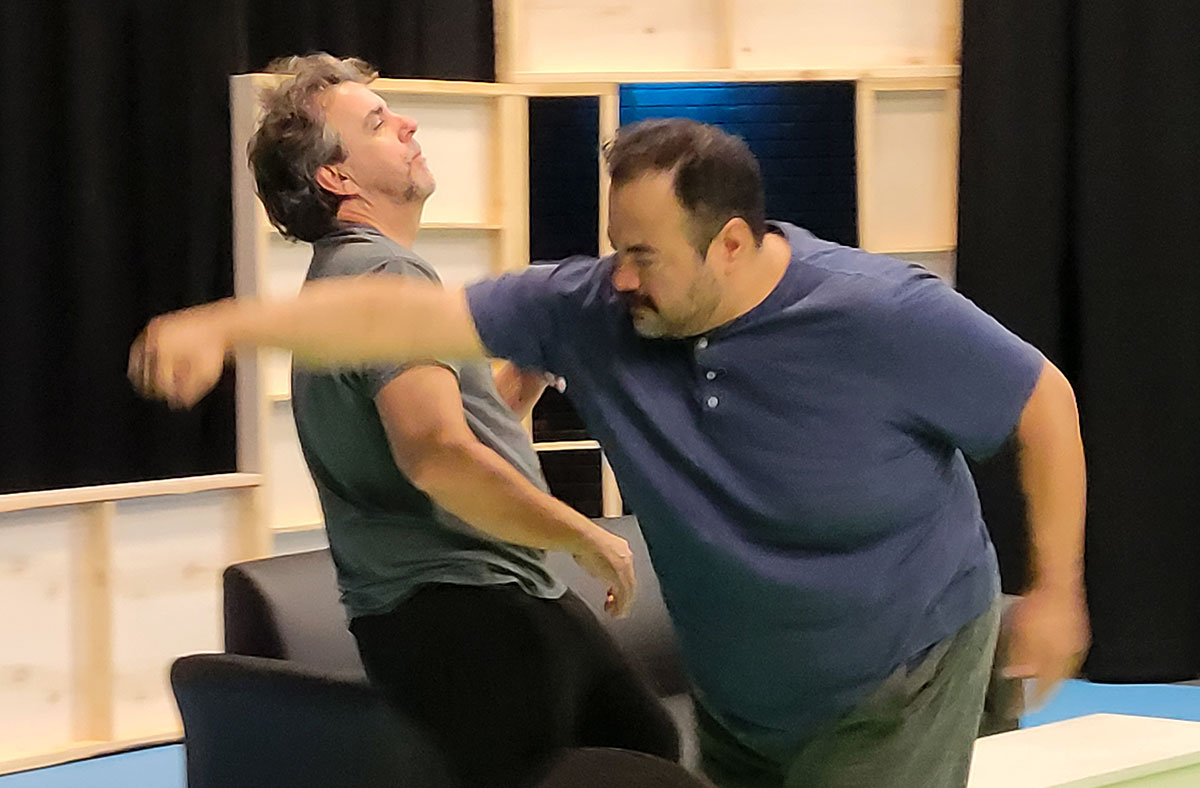 Joseph Lyle Tyler (left) and Orlando Arriaga practicing their fight in "Landscape with Weapon." UP photo by Erin Conlin.
