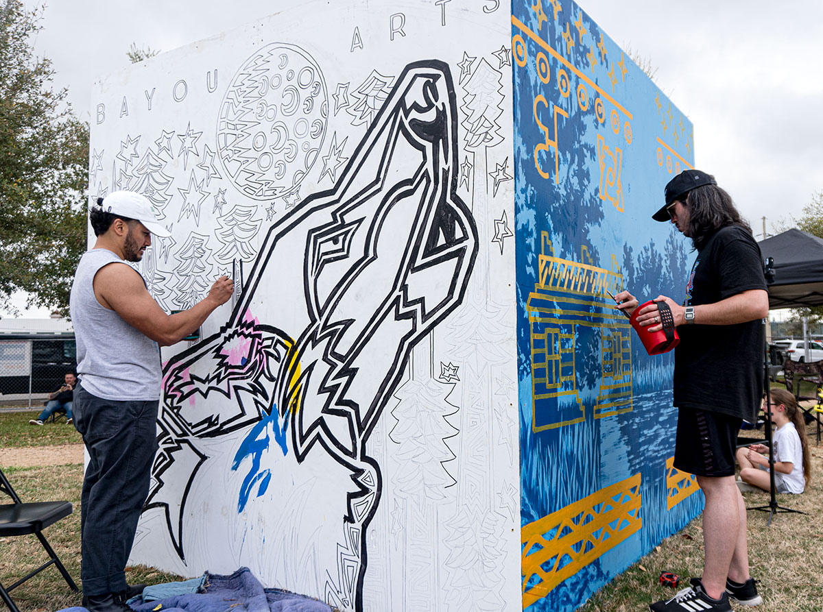 Mario Robert Ramos and Dario Bucheli painting on their cubes during Mural Fest 2024, in downtown Beaumont, Mar. 2. UP photo by Carlos Viloria.