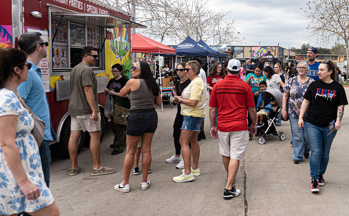 A crowd of people walking around the Beaumont Event Centre during Mural Fest 2024, in downtown Beaumont, Mar. 2. UP photo by Carlos Viloria.