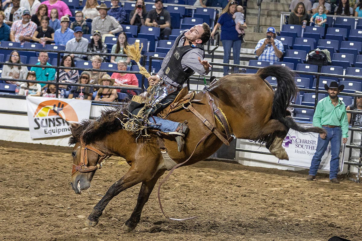 Cowboy rides a horse during the South Texas State Fair Rodeo, Beaumont, Texas, March 23. UP photo by Brian Quijada.