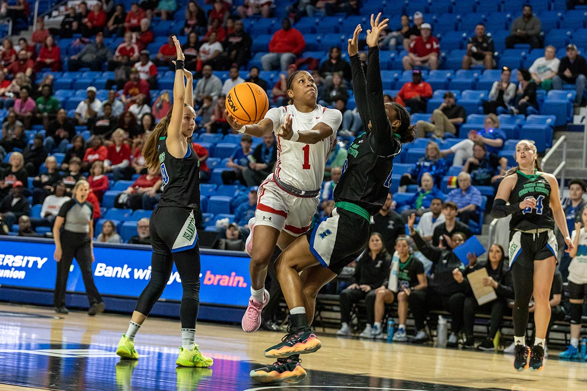 Lamar guard Jacei Denley goes up for a basket against two TAMUCC defenders during the Southland Conference tournament final, in The Legacy Center, Lake Charles, La. March 14. UP photo by Brian Quijada.
